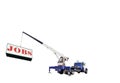 Blue Crane Truck Lifting a Sign That Reads `JOBS` Royalty Free Stock Photo